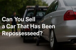 A silver car being towed by a black tow truck on a suburban street, with the text "Can You Sell a Car That Has Been Repossessed?" overlayed.