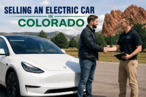 Selling an electric car in Colorado with a cash buyer beside an electric vehicle