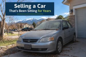 Used car sitting for years in a Colorado home driveway, ready to sell as a used, junk, or non-running car.