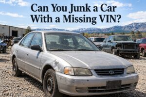 Junk car in a Colorado salvage yard beneath a title about selling a car with a missing VIN.
